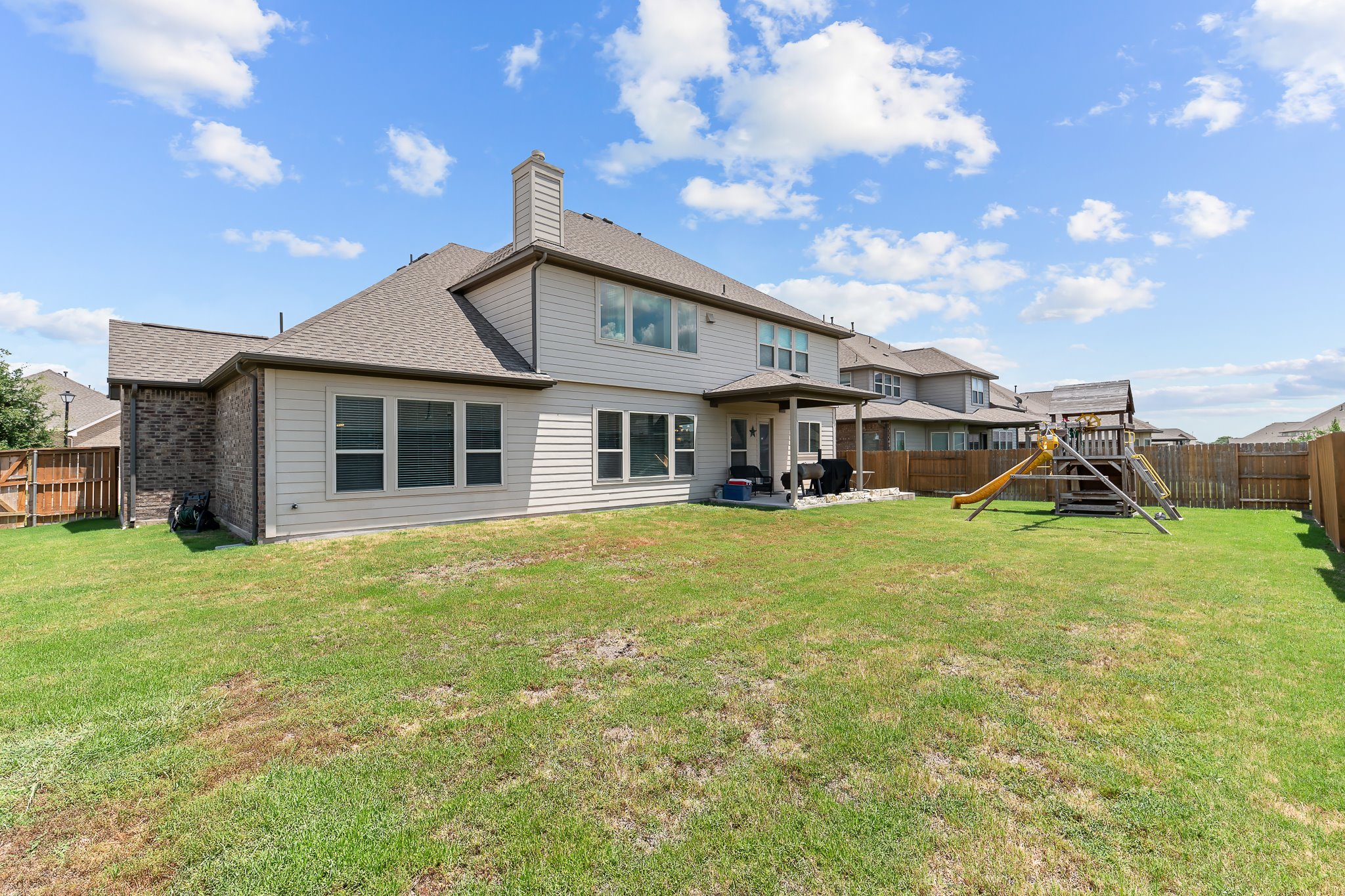 3501 Great Knot Pass Pflugerville, TX 78660 - Photo 33 of 40 a front view of a house with a garden