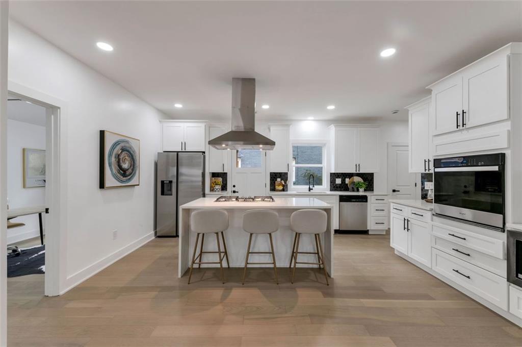 208 Watson Circle Southeast Atlanta, GA 30317 - Photo 18 of 45 a living room with furniture a flat screen tv and kitchen view