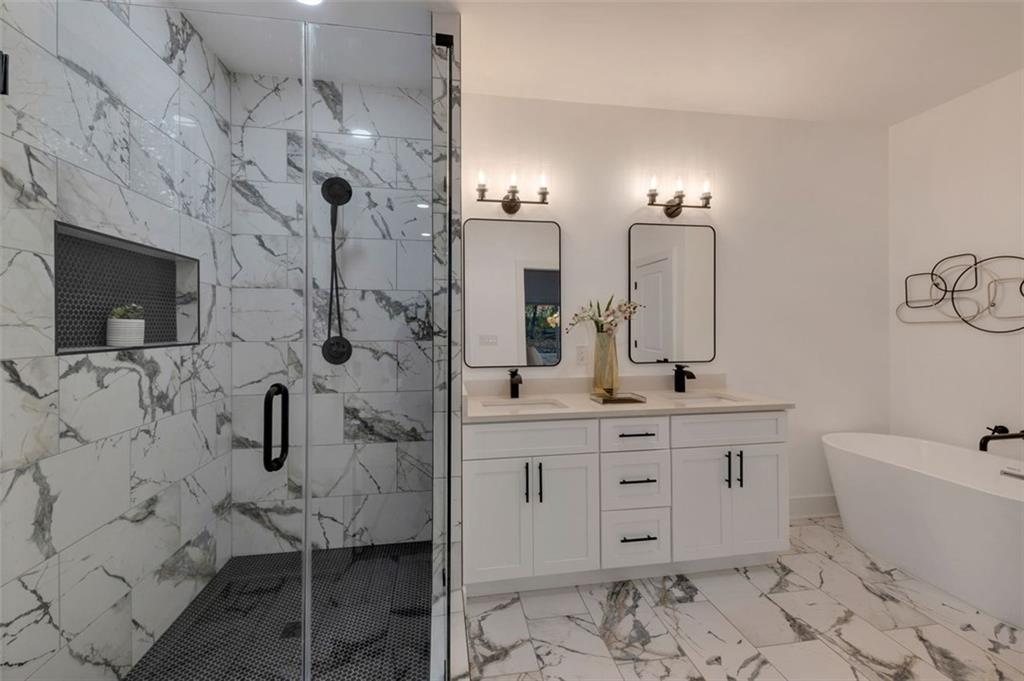 208 Watson Circle Southeast Atlanta, GA 30317 - Photo 28 of 45 a spacious bathroom with a double vanity sink toilet and shower