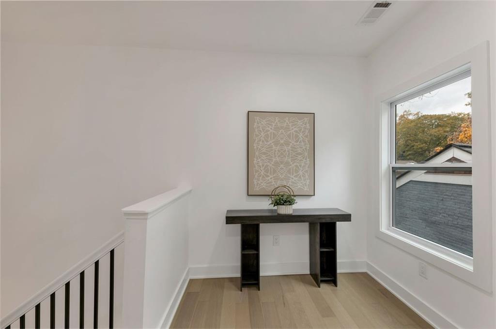 208 Watson Circle Southeast Atlanta, GA 30317 - Photo 30 of 45 a view of a room with a window and wooden floor
