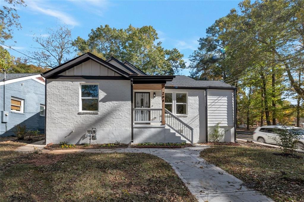 208 Watson Circle Southeast Atlanta, GA 30317 - Photo 3 of 45 a front view of a house with a yard and garage