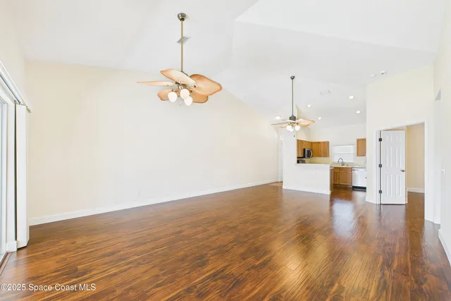 a spacious bathroom with a double vanity sink a mirror and a bathtub