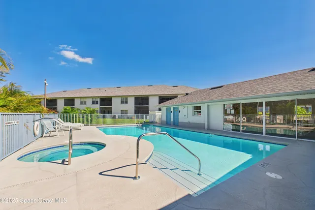 a view of a balcony with floor to ceiling window