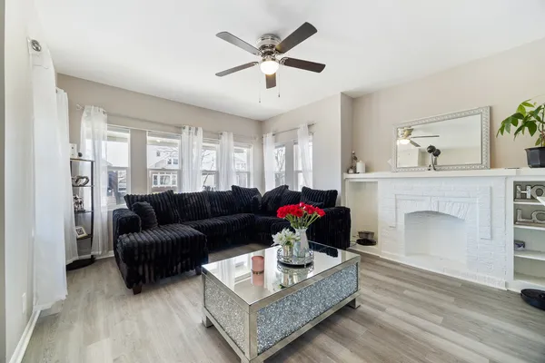 a living room with furniture and a fireplace