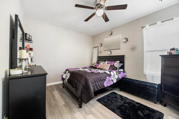a bedroom with a bed and cabinets