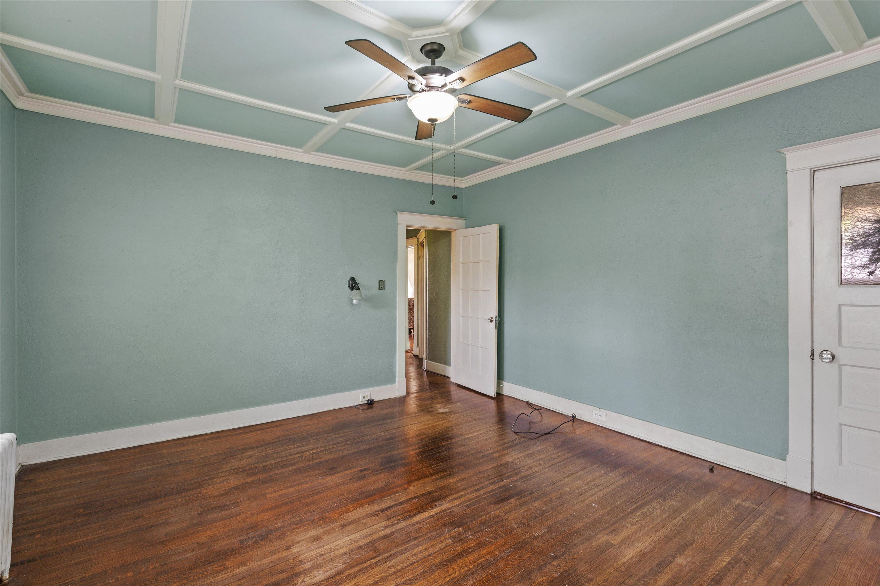 569 North Trezevant Street Memphis, TN 38112 - Photo 13 of 26 an empty room with wooden floor fan and windows