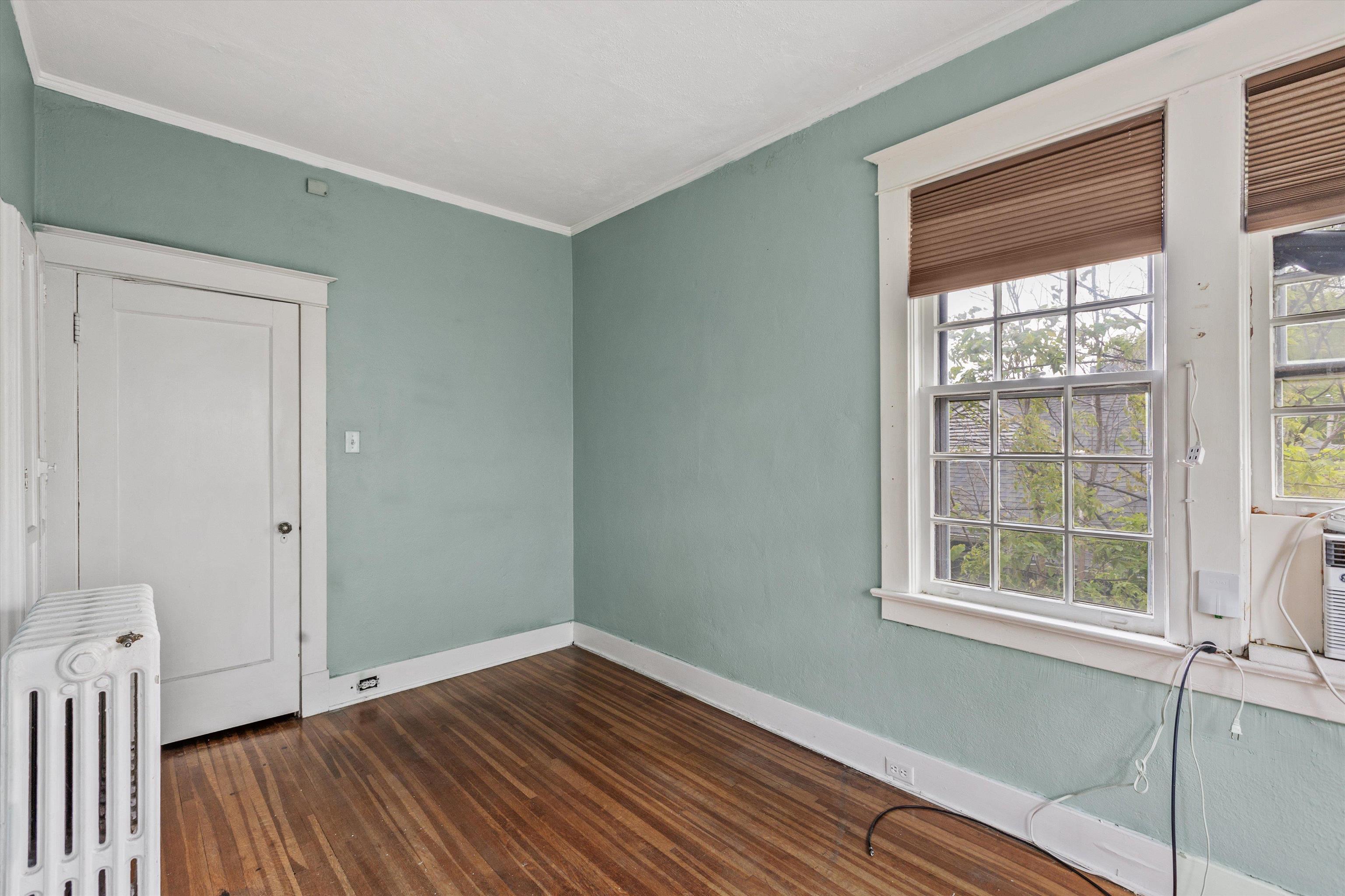 569 North Trezevant Street Memphis, TN 38112 - Photo 16 of 26 a view of empty room with wooden floor and fan