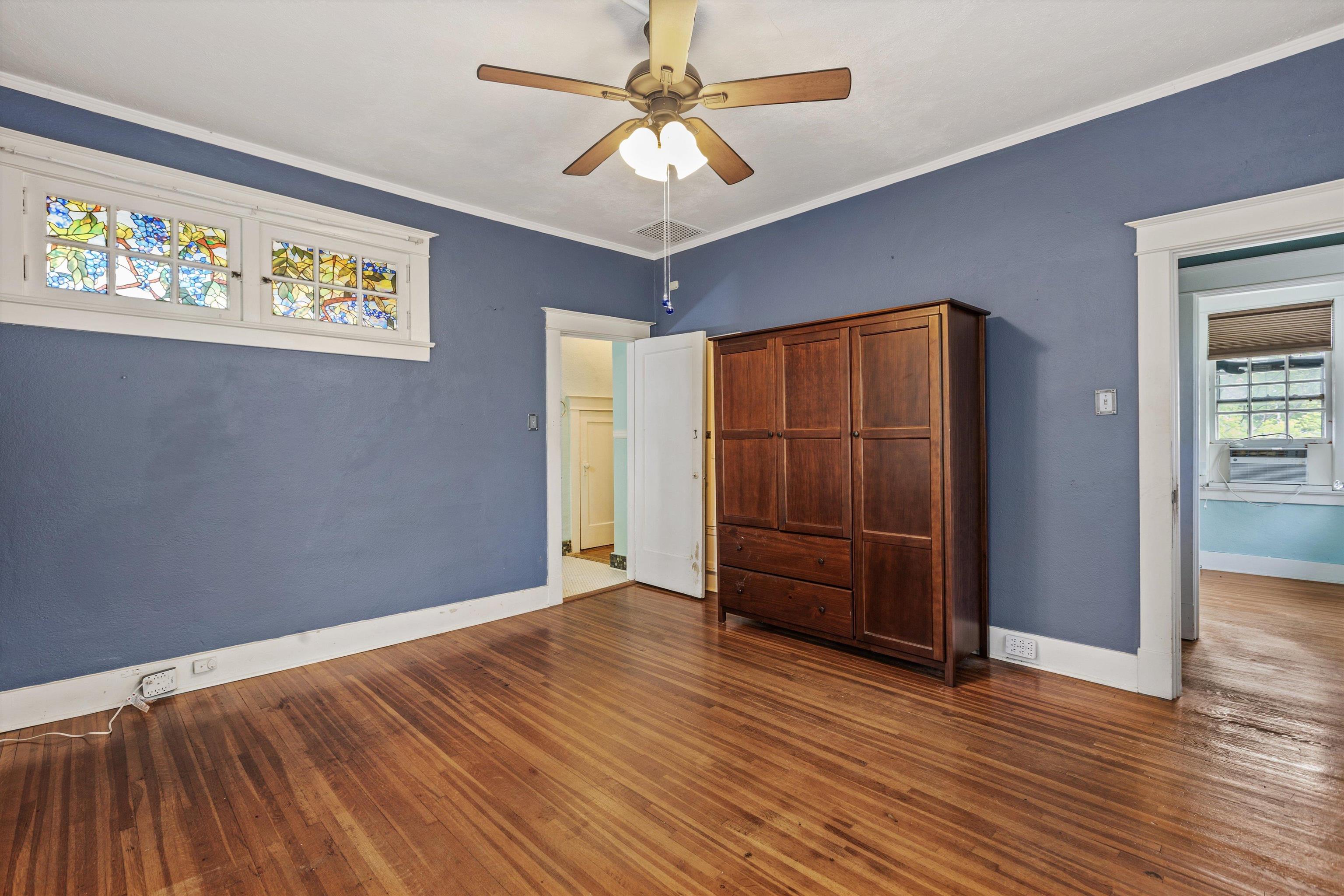 569 North Trezevant Street Memphis, TN 38112 - Photo 19 of 26 a view of an empty room with wooden floor