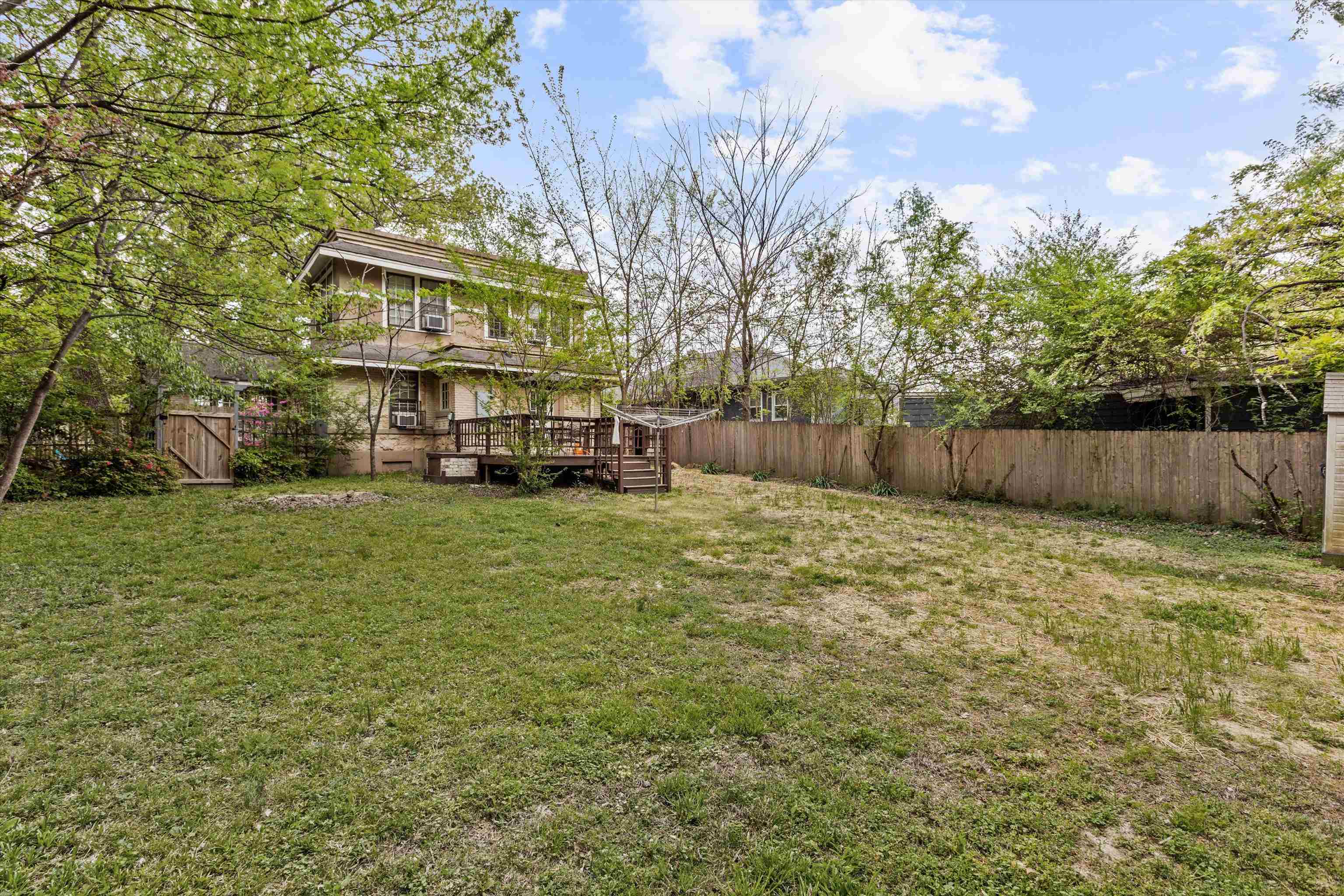 569 North Trezevant Street Memphis, TN 38112 - Photo 24 of 26 a view of street with houses and trees in the background