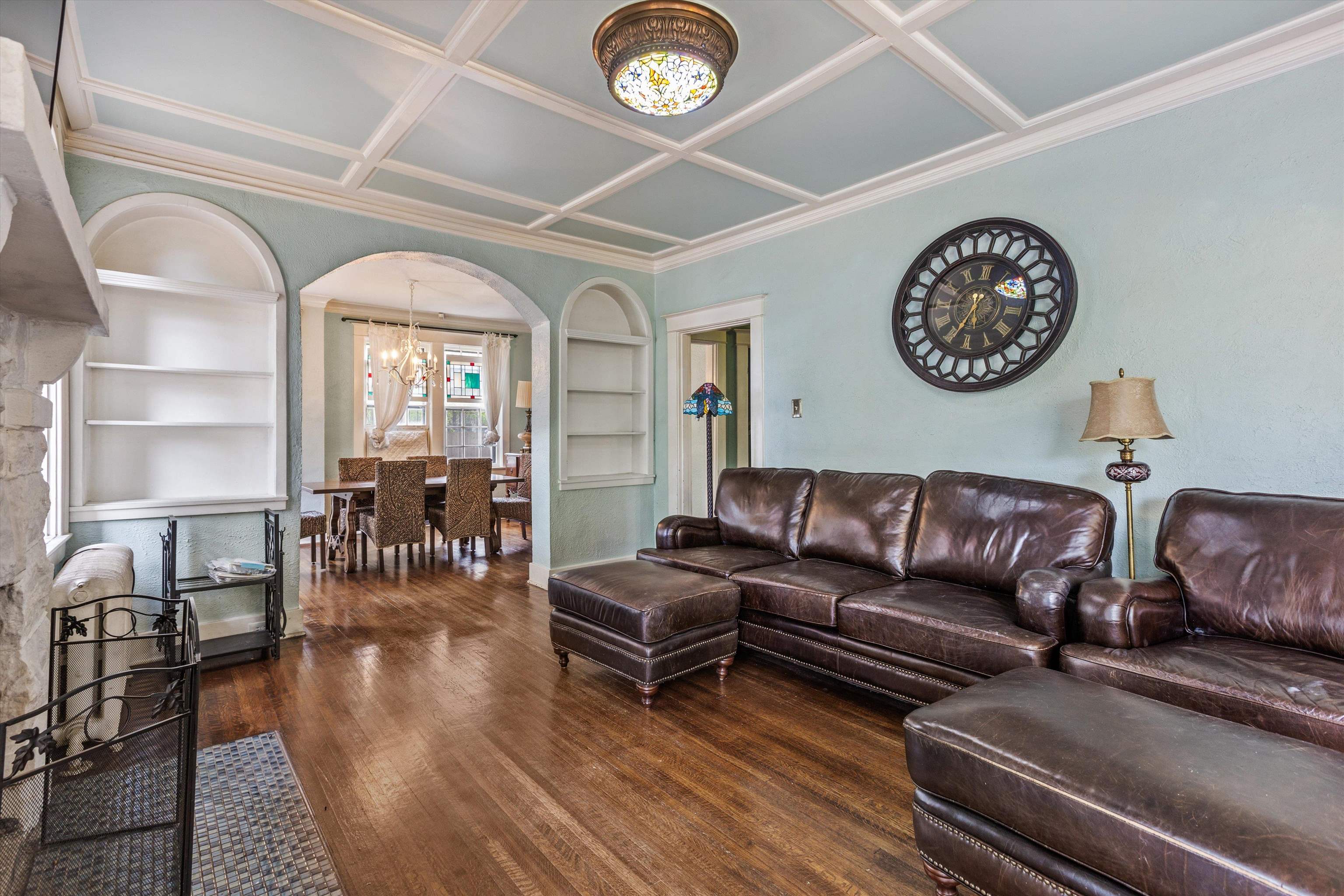 569 North Trezevant Street Memphis, TN 38112 - Photo 3 of 26 a living room with couches a large mirror with wooden floor