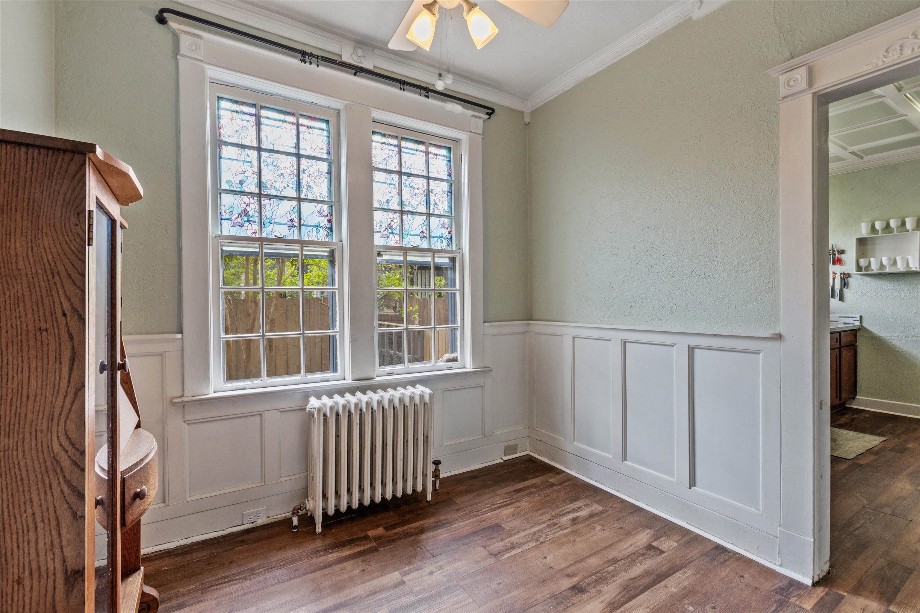 569 North Trezevant Street Memphis, TN 38112 - Photo 8 of 26 an empty room with wooden floor and windows
