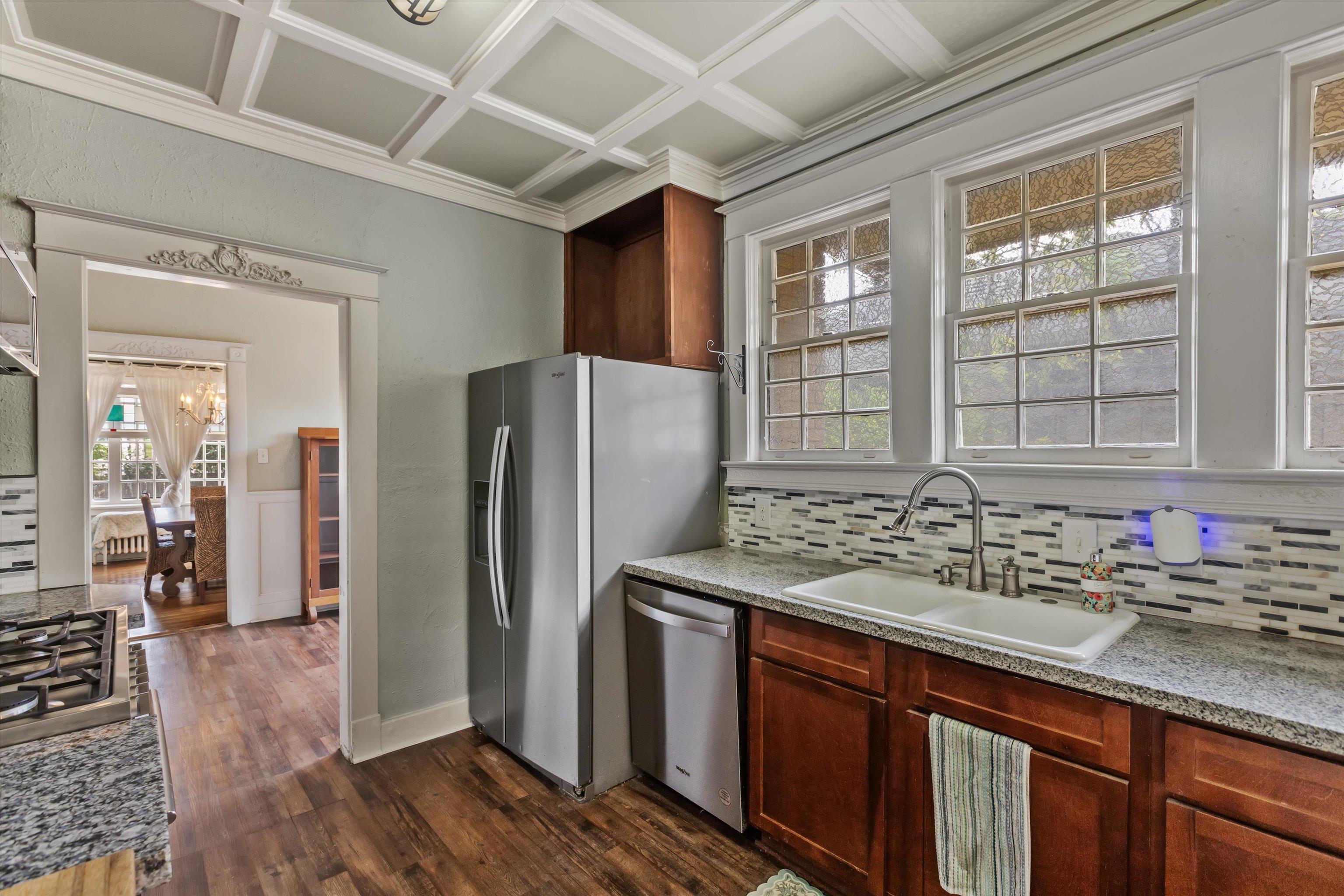 569 North Trezevant Street Memphis, TN 38112 - Photo 9 of 26 a kitchen with stainless steel appliances granite countertop a refrigerator and a sink