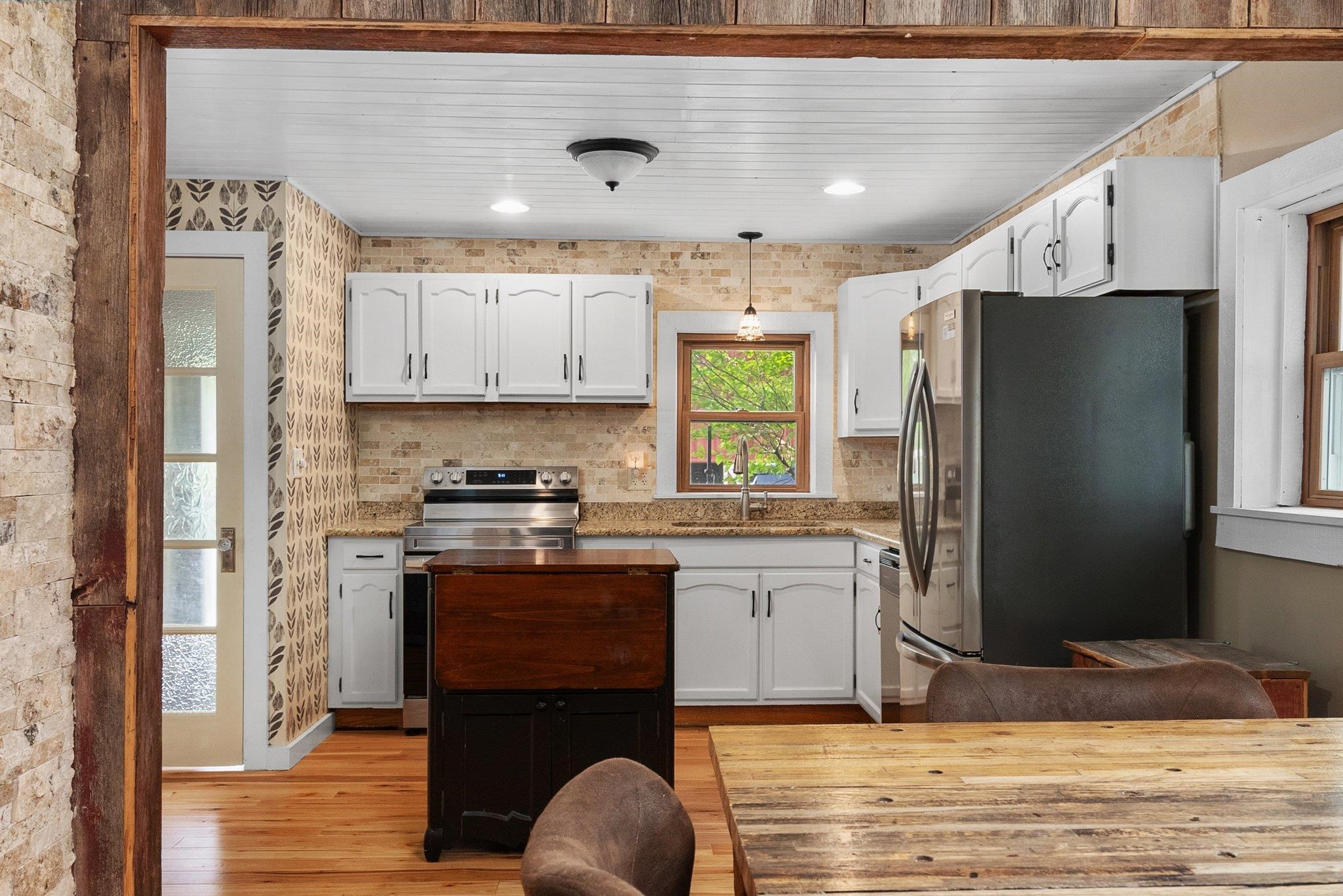 14657 Prairie Road Rockton, IL 61072 - Photo 16 of 55 a kitchen with stainless steel appliances granite countertop a refrigerator sink and stove