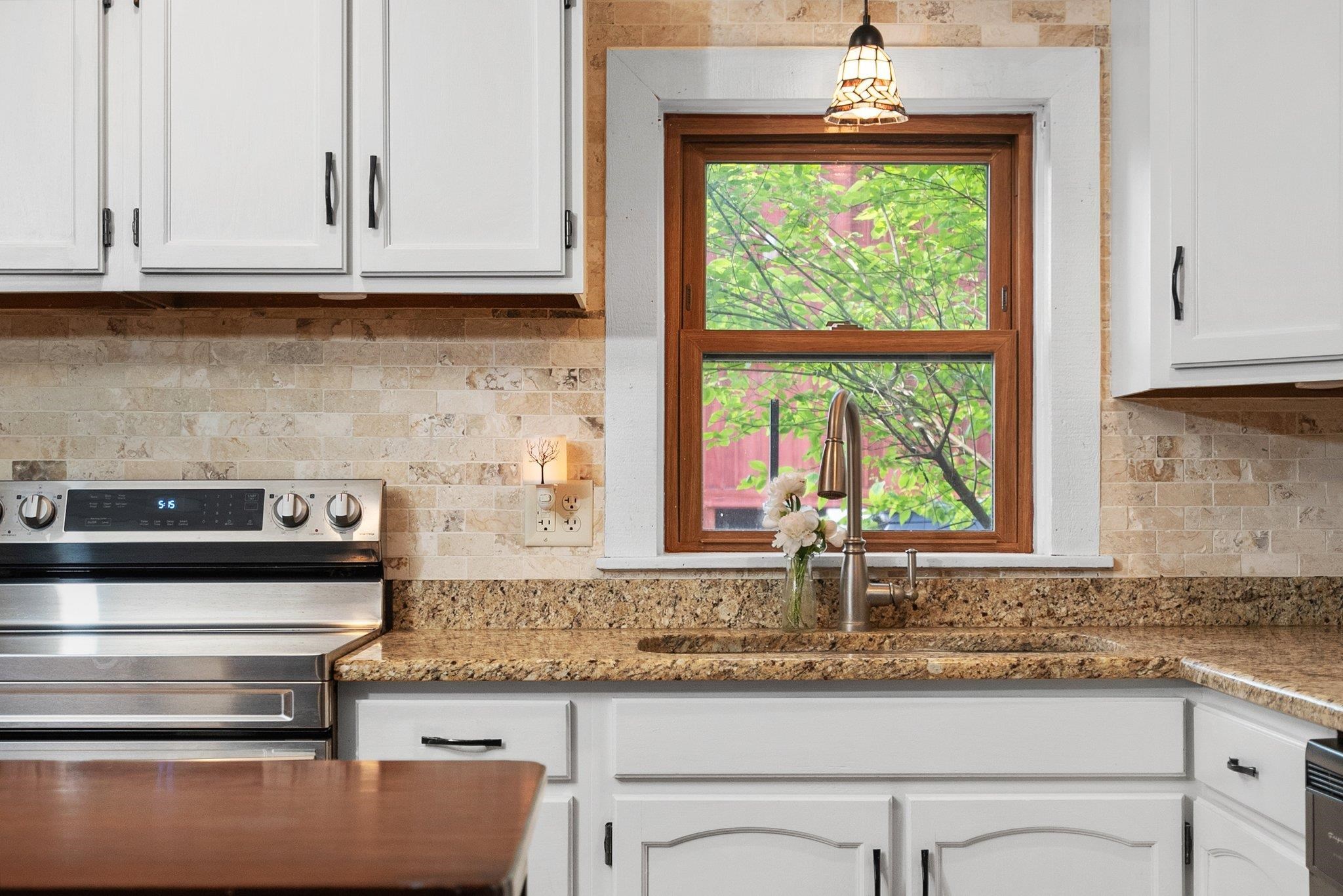 14657 Prairie Road Rockton, IL 61072 - Photo 17 of 55 a kitchen with granite countertop a sink and a window
