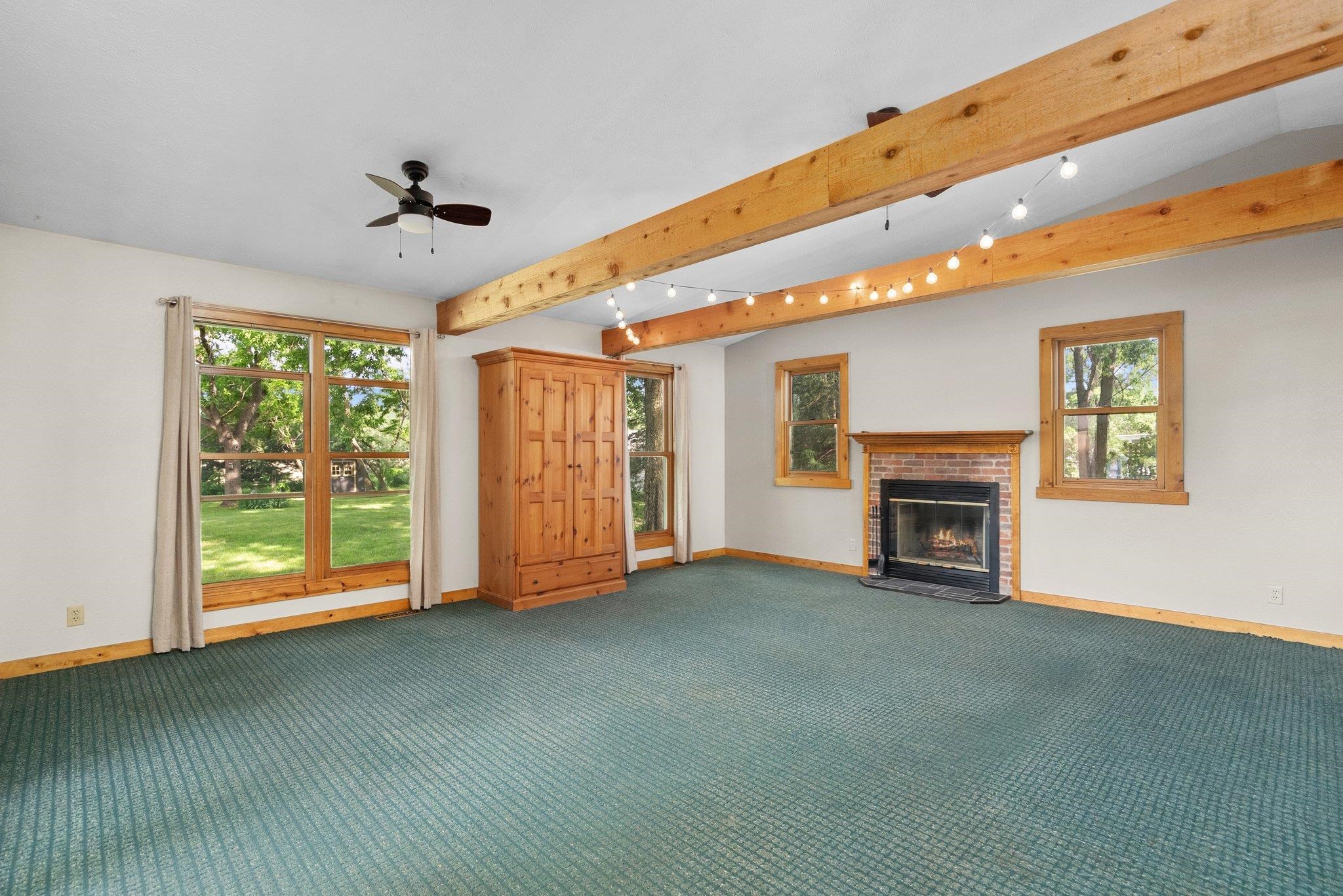 14657 Prairie Road Rockton, IL 61072 - Photo 25 of 55 a view of an empty room with a fireplace and a window