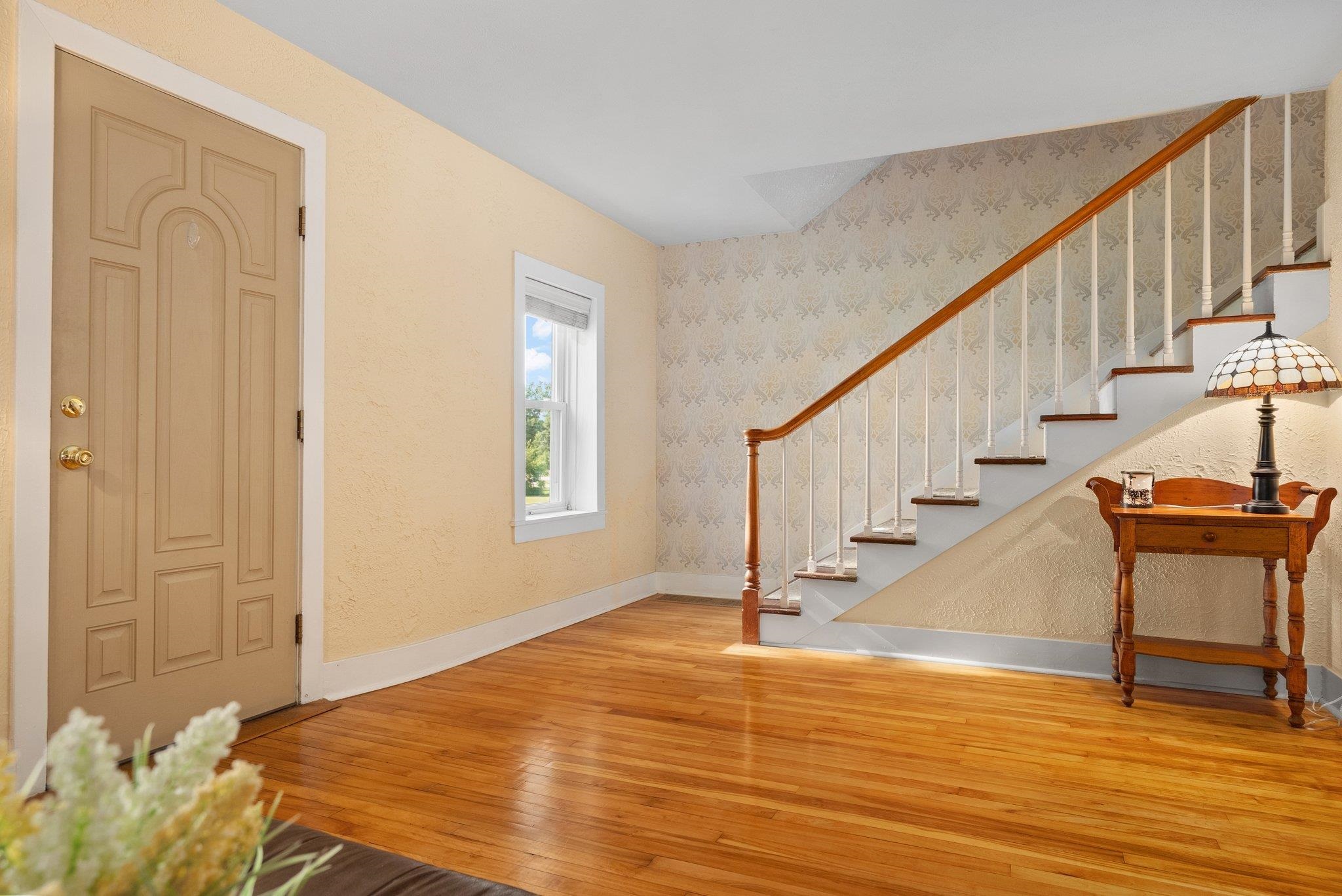 14657 Prairie Road Rockton, IL 61072 - Photo 28 of 55 a view of a livingroom with wooden floor and stairs
