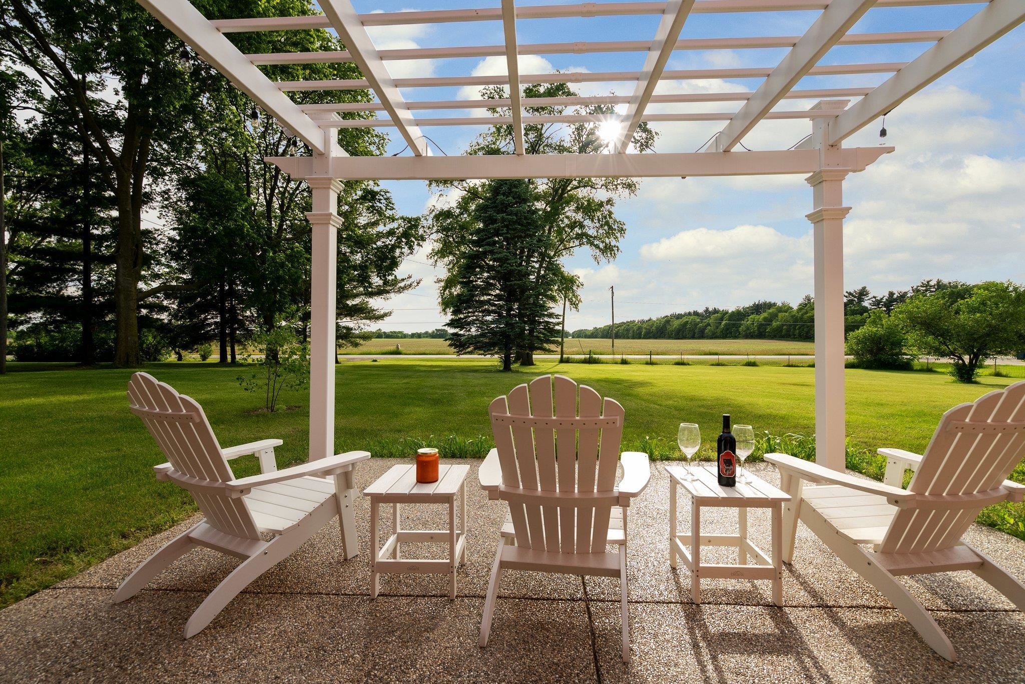 14657 Prairie Road Rockton, IL 61072 - Photo 45 of 55 a view of a lake with couches in patio