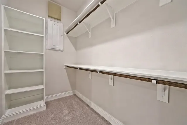 a view of an empty walk in closet