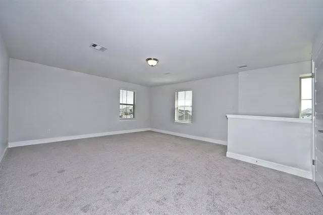 a view of empty room with windows