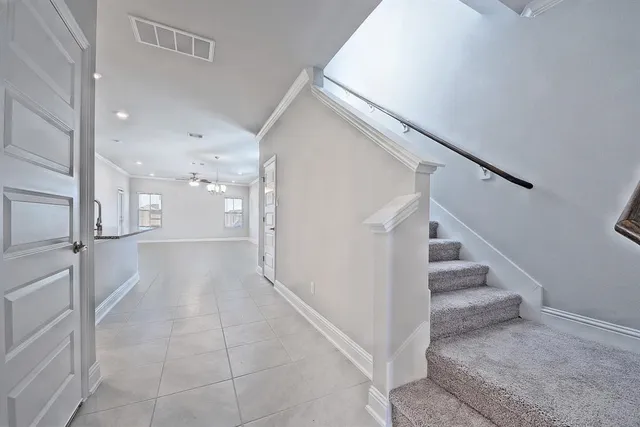 a view of entryway and hall with a rug
