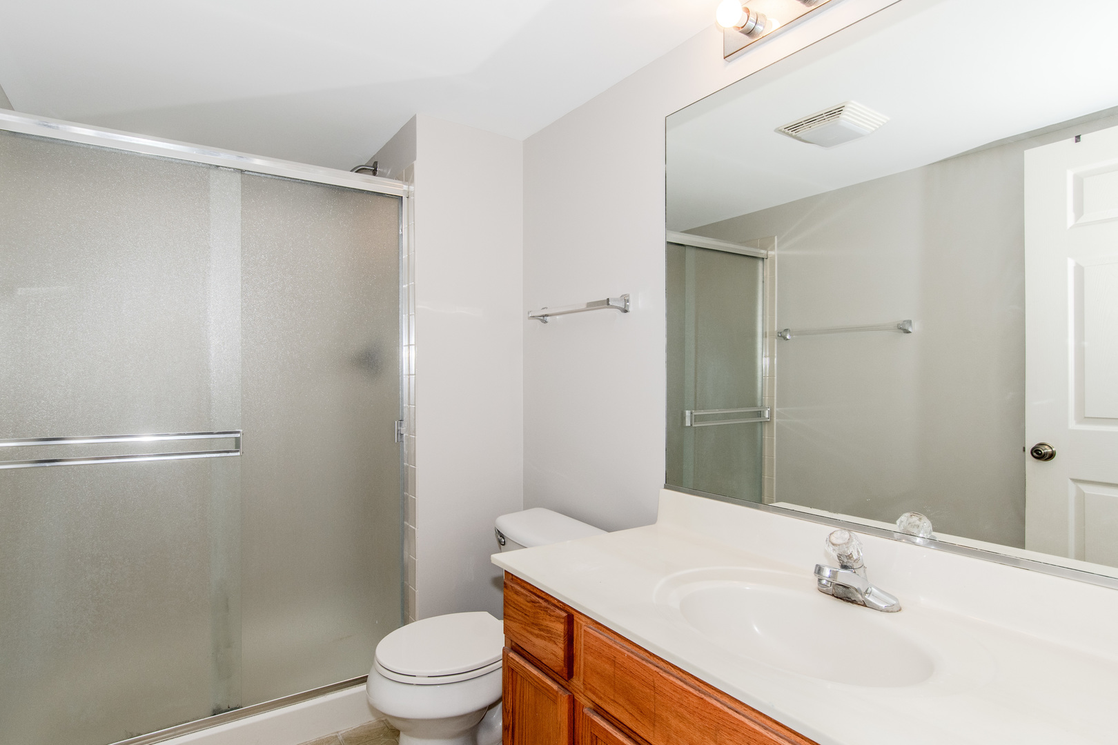 2819 Rutland Circle, Unit 103 Naperville, IL 60564 - Photo 11 of 25 a bathroom with a sink toilet and shower