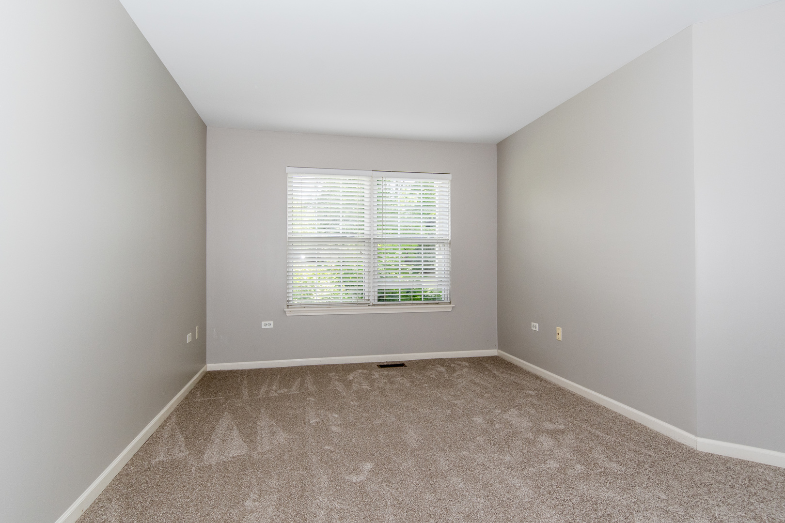 2819 Rutland Circle, Unit 103 Naperville, IL 60564 - Photo 12 of 25 an empty room with windows