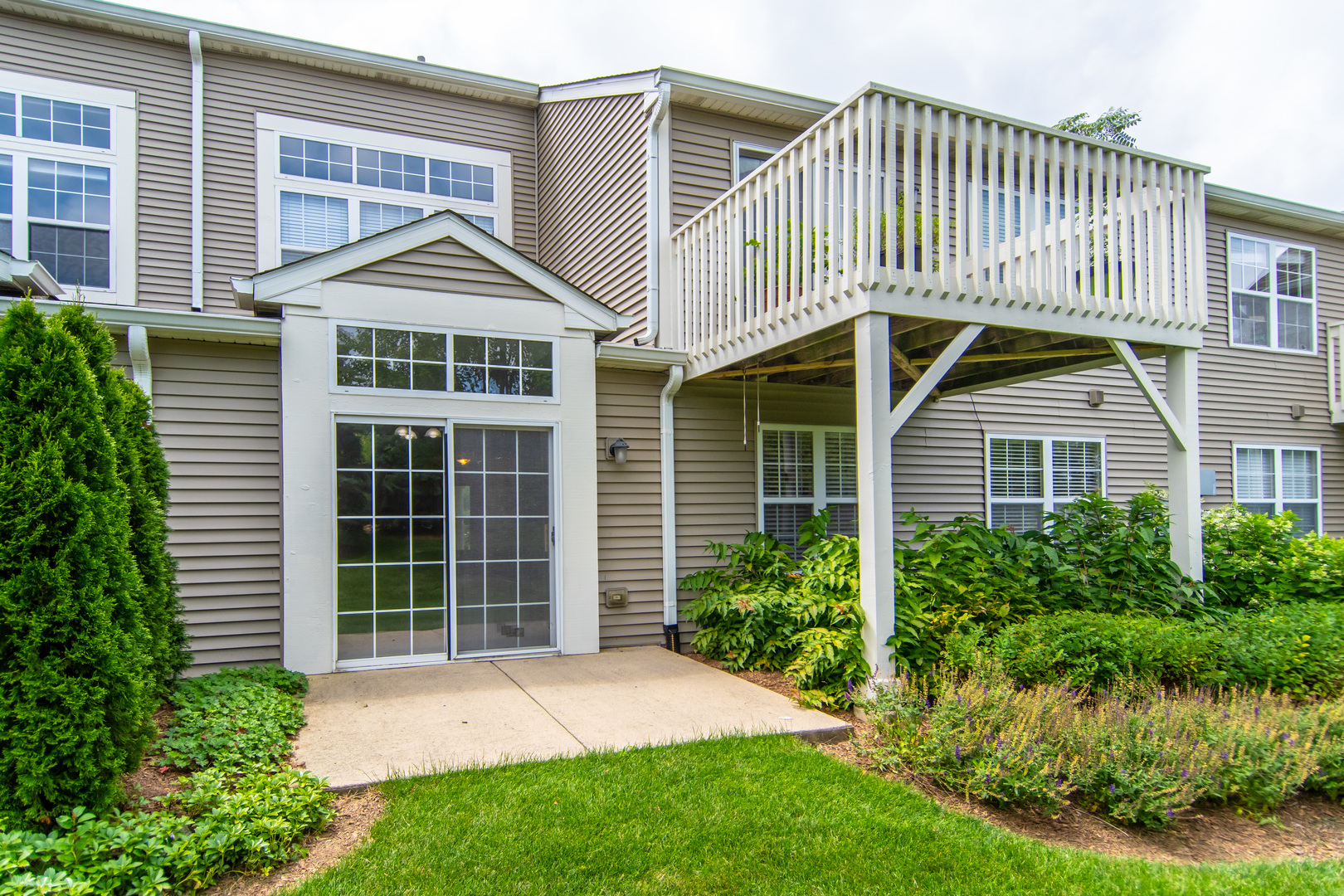 2819 Rutland Circle, Unit 103 Naperville, IL 60564 - Photo 15 of 25 a front view of a house with a yard