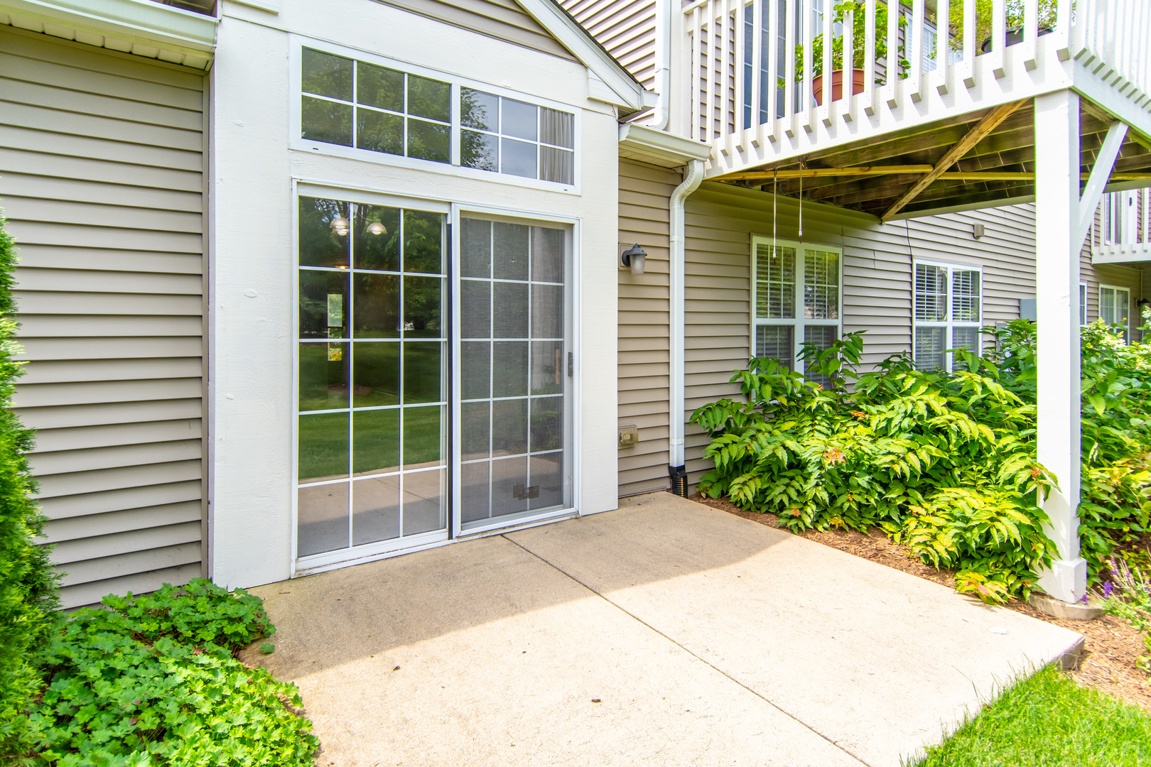 2819 Rutland Circle, Unit 103 Naperville, IL 60564 - Photo 16 of 25 a view of a backyard with plants