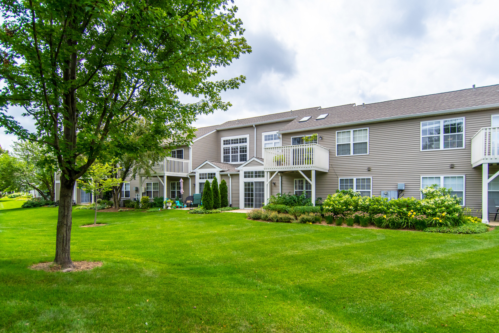 2819 Rutland Circle, Unit 103 Naperville, IL 60564 - Photo 18 of 25 a front view of house with yard and green space