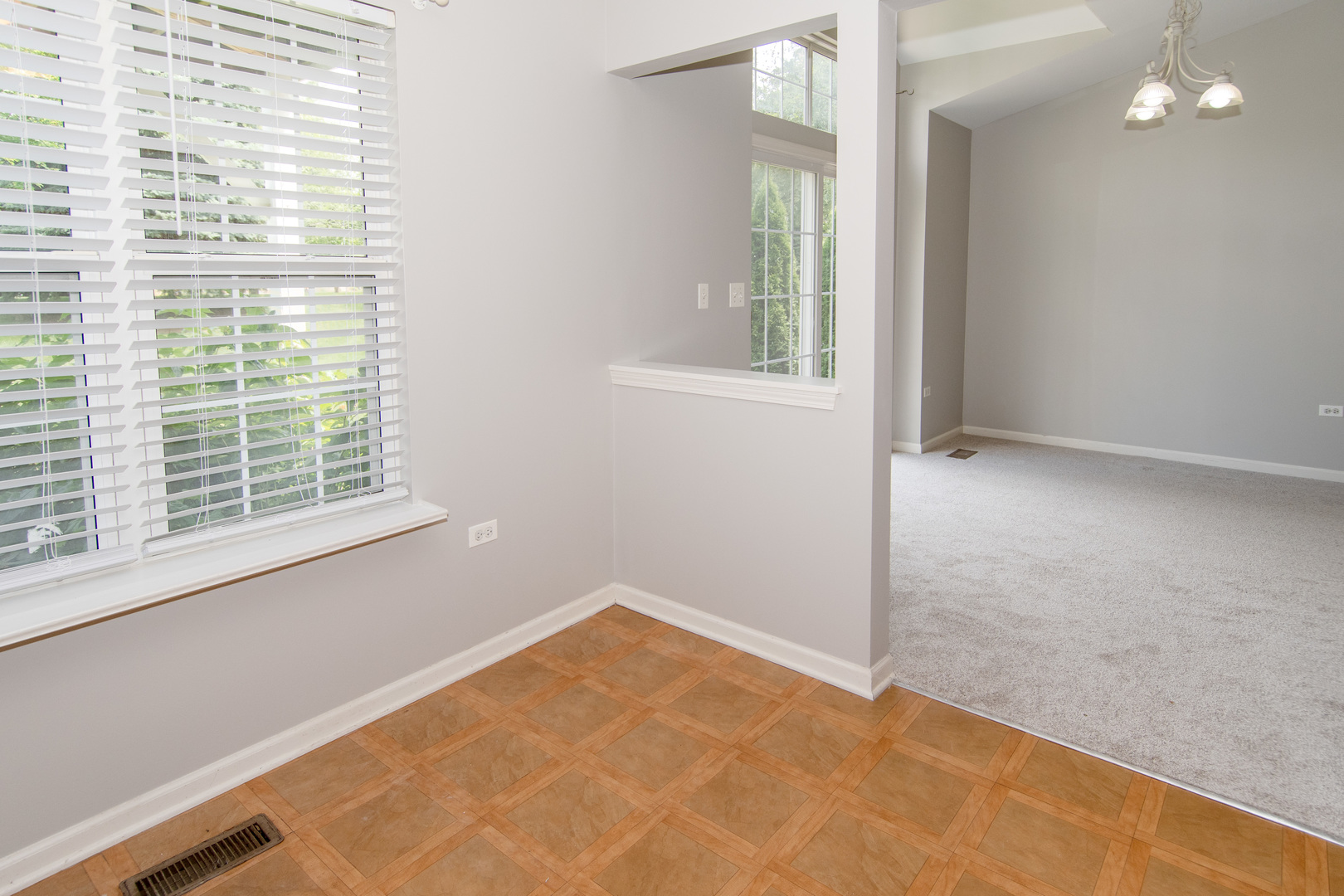 2819 Rutland Circle, Unit 103 Naperville, IL 60564 - Photo 6 of 25 a view of an empty room with a window