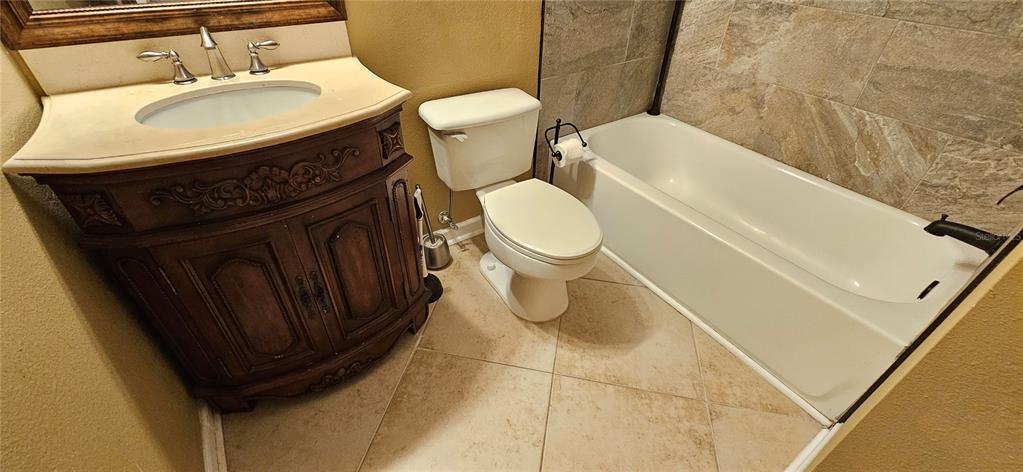 4340 South Kirkman Road, Unit 912 Orlando, FL 32811 - Photo 11 of 21 a bathroom with a sink and a toilet