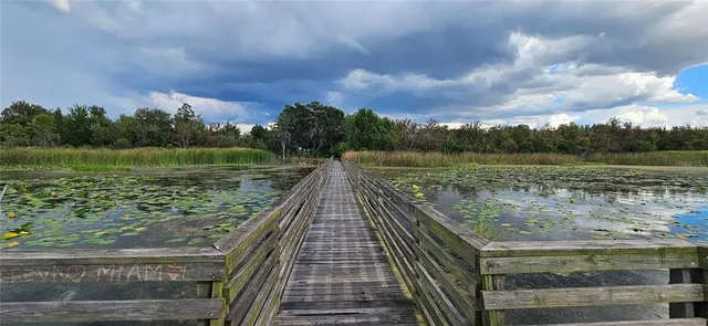 a view of a lake with a yard