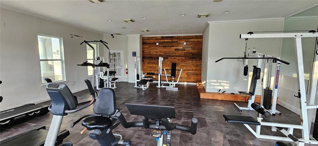 4340 South Kirkman Road, Unit 912 Orlando, FL 32811 - Photo 20 of 21 a view of a room with gym equipment