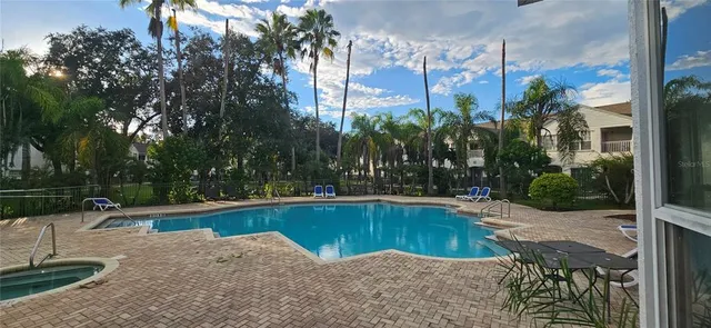 a view of a swimming pool with a patio