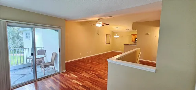 a view of kitchen and utility room with wooden floor