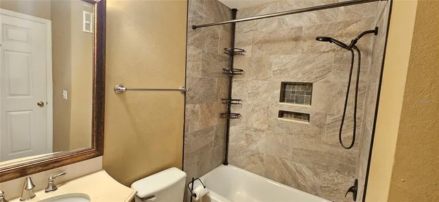 a bathroom with a shower and toilet