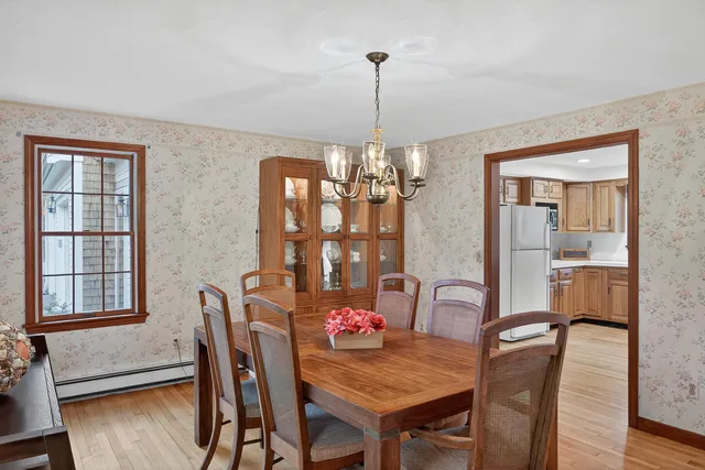 a dining room with furniture and window