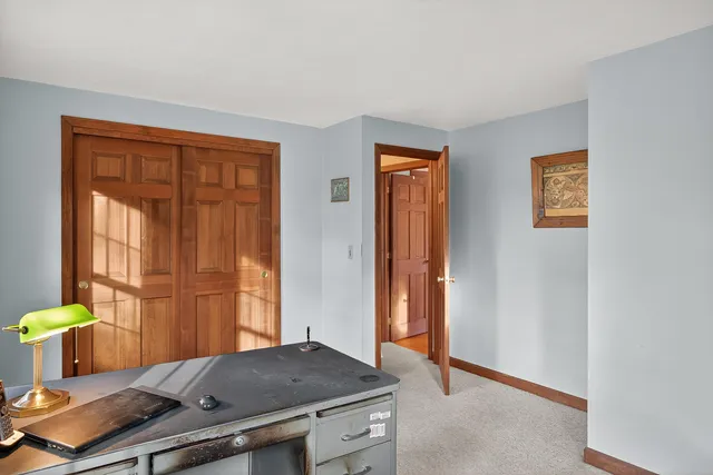 a view of balcony with wooden floor and outdoor seating