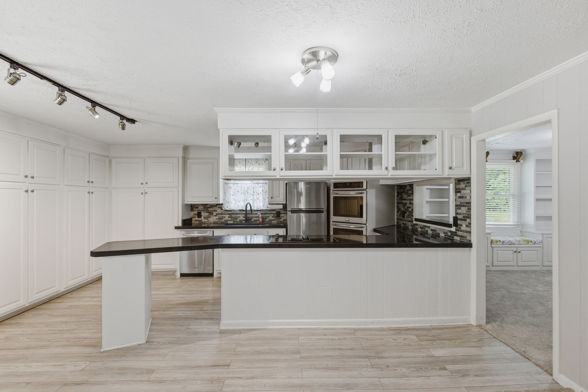 580 Defeated Creek Road Centerville, TN 37033 - Photo 15 of 71 a kitchen with stainless steel appliances granite countertop a stove and cabinets