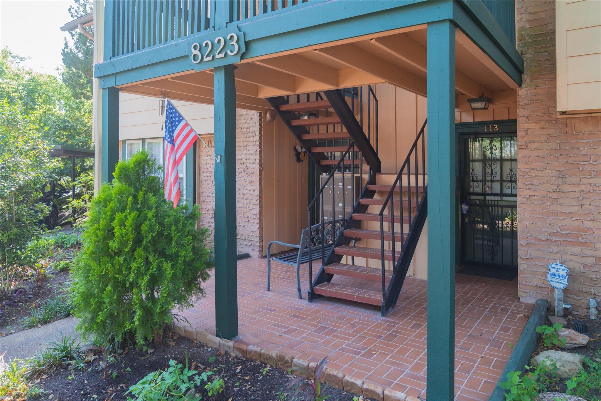 8223 Kingsbrook Road, Unit 212 Houston, TX 77024 - Photo 9 of 10 a view of path along with potted plant and stairs