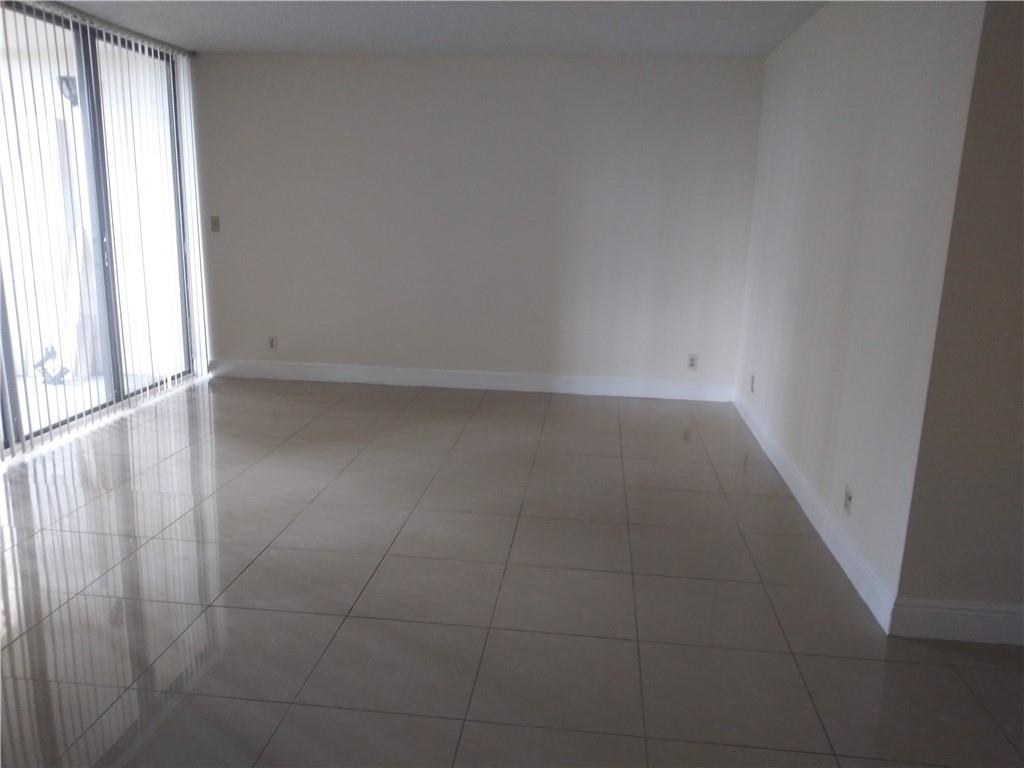 4200 Inverrary Boulevard, Unit 3306 Lauderhill, FL 33319 - Photo 2 of 4 en empty room with windows
