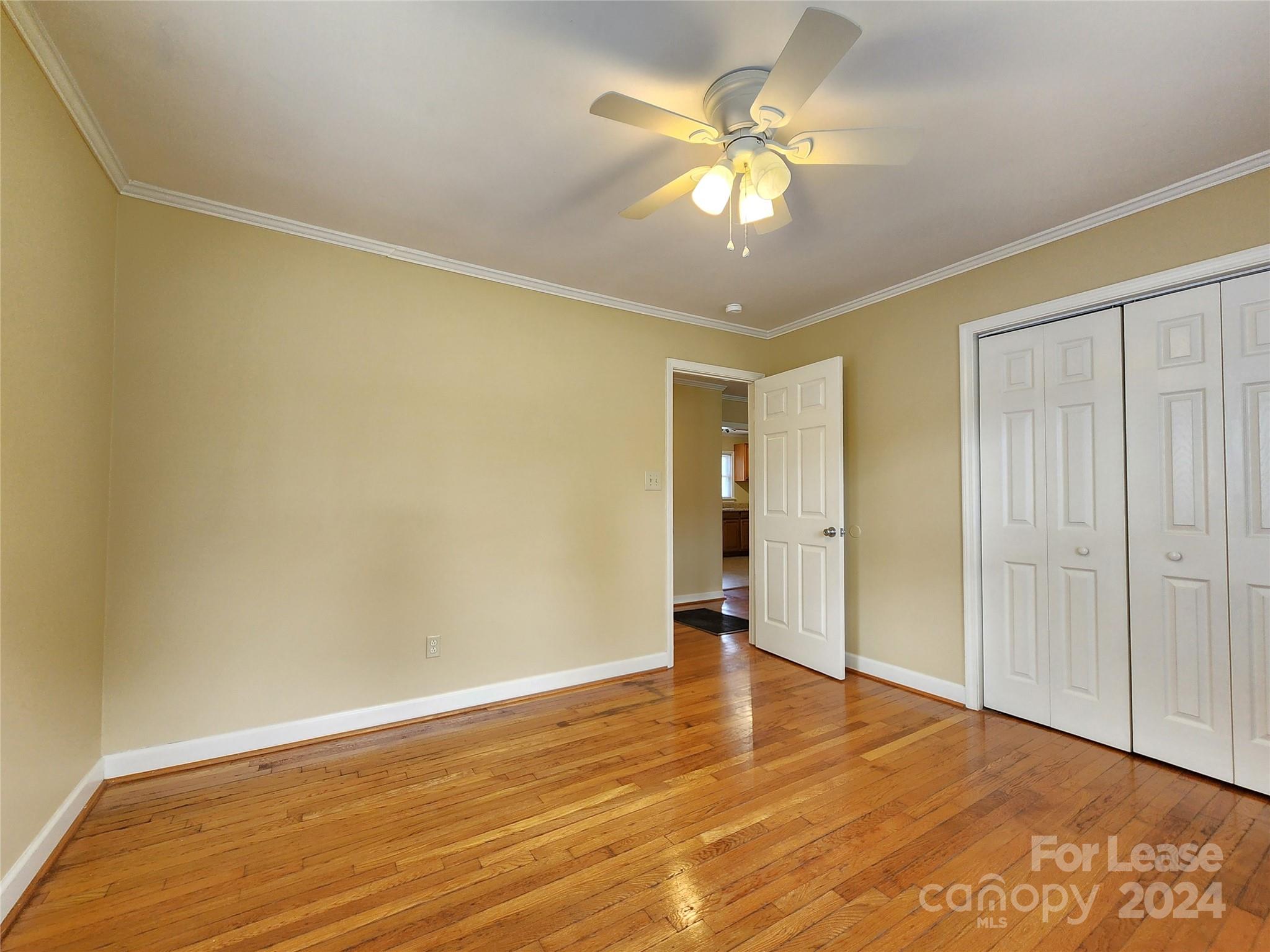 2117 Oakdale Road Charlotte, NC 28216 - Photo 11 of 20 a view of an empty room with wooden floor