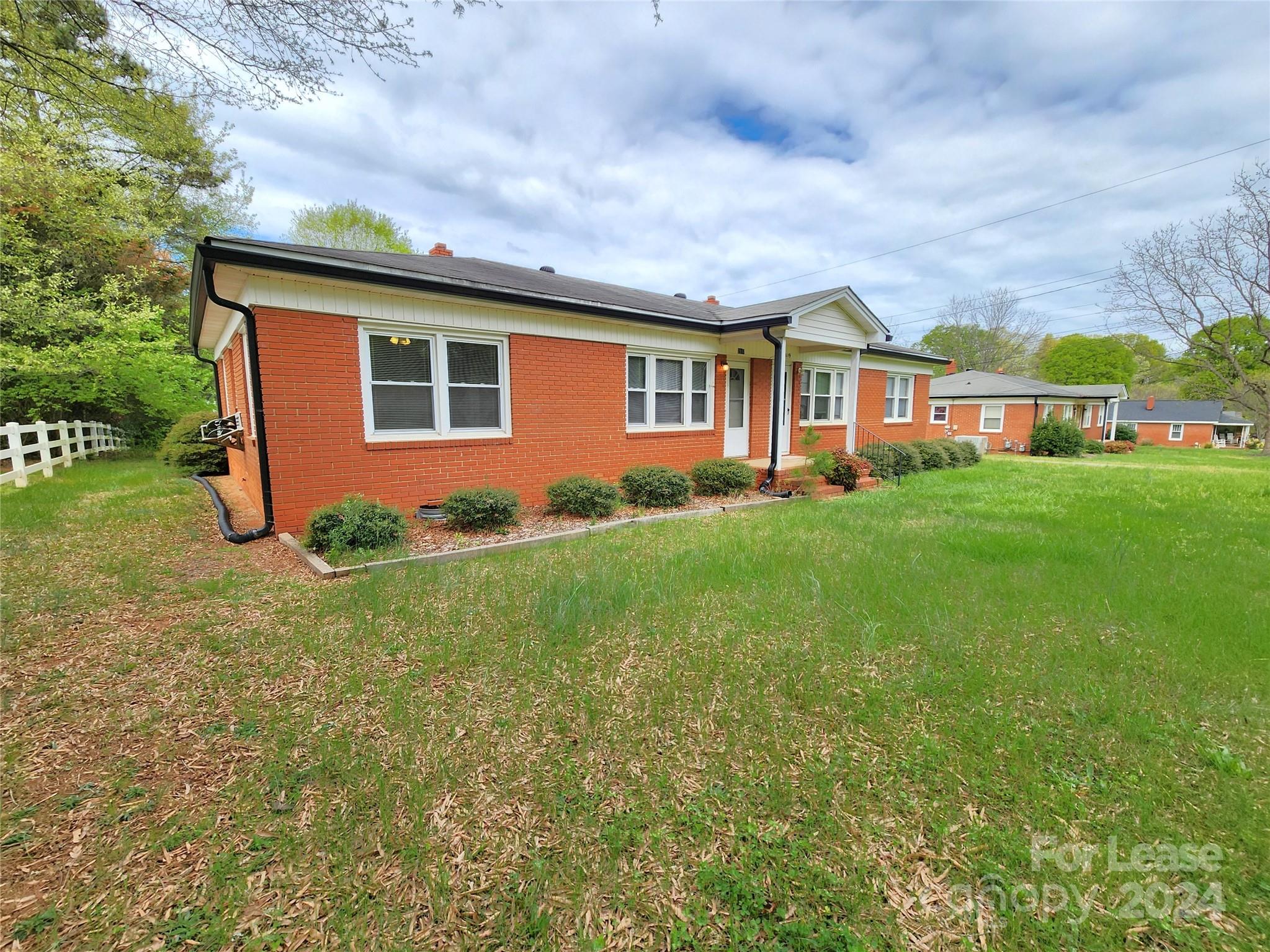 2117 Oakdale Road Charlotte, NC 28216 - Photo 19 of 20 a front view of house with yard and green space