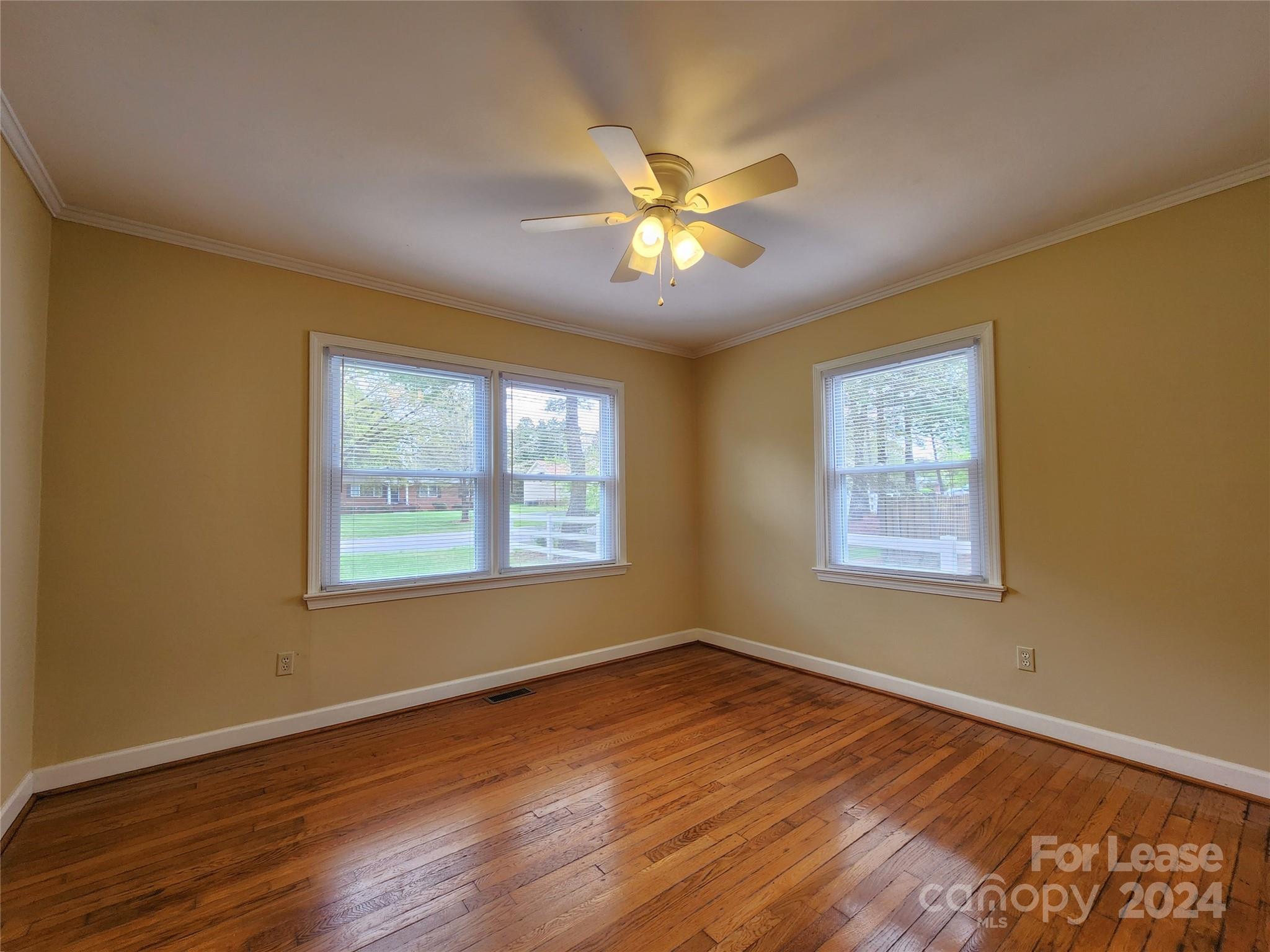 2117 Oakdale Road Charlotte, NC 28216 - Photo 10 of 20 a view of a room with wooden floor and windows