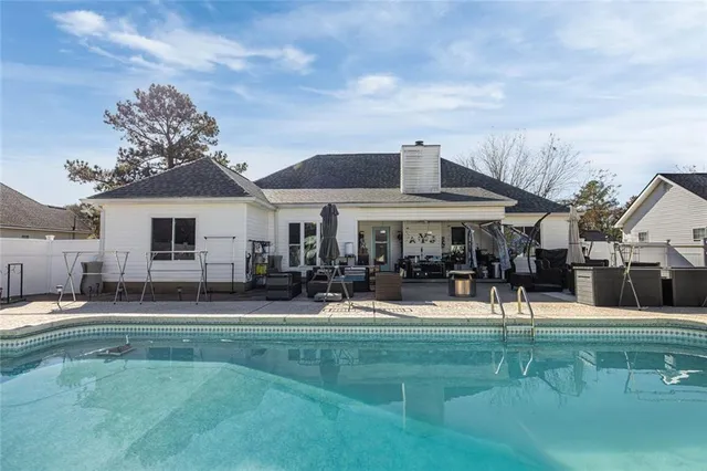 a front view of house with yard and sitting area