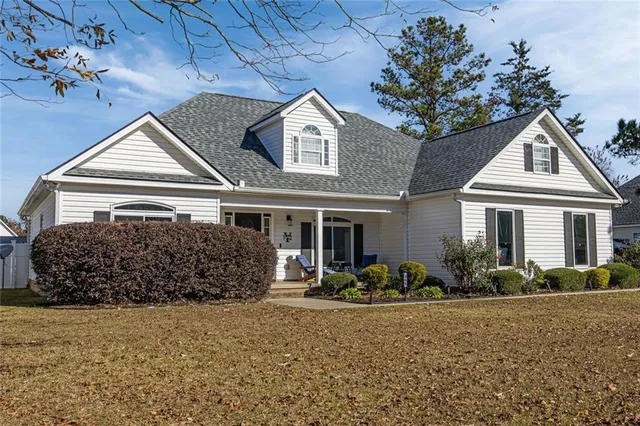 a front view of a house with garden
