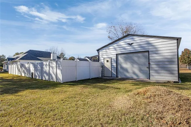 a view of a backyard of the house