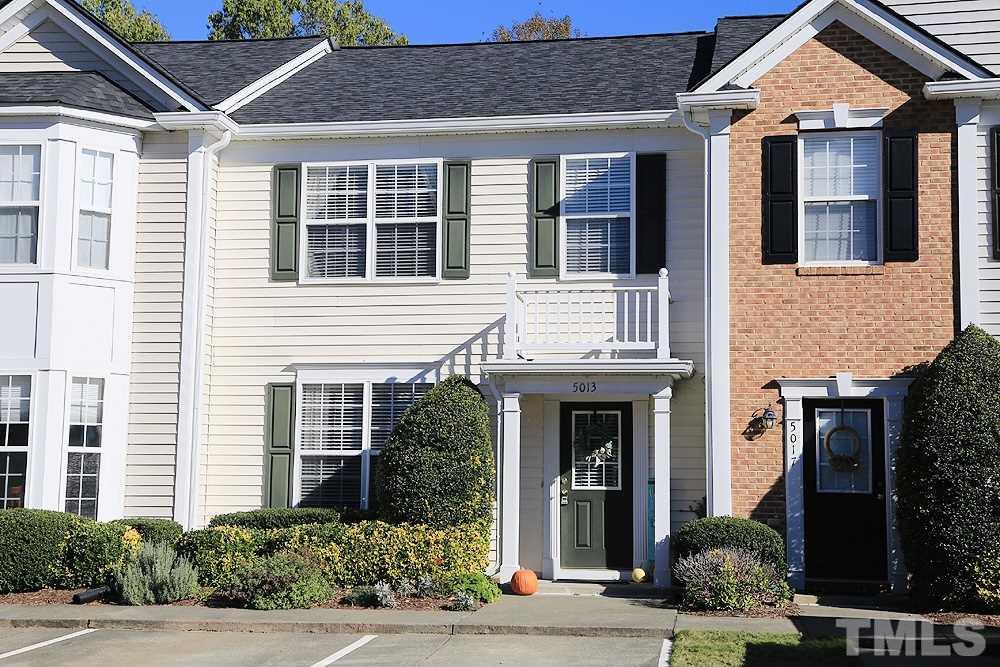 5013 Echo Ridge Road Raleigh, NC 27612 - Photo 1 of 15 a front view of a house with a yard