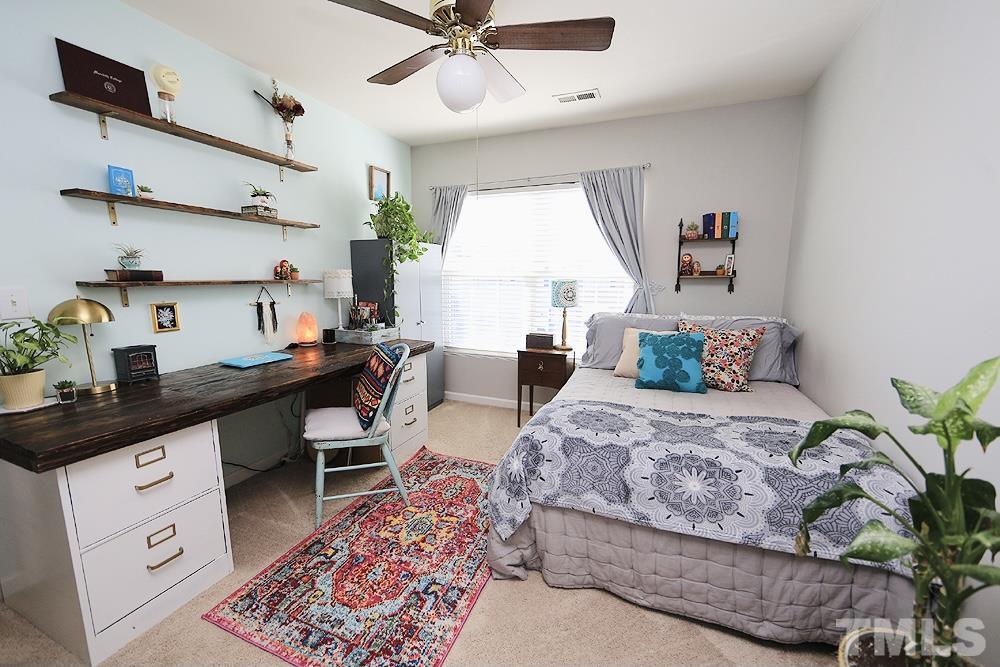 5013 Echo Ridge Road Raleigh, NC 27612 - Photo 11 of 15 a living room with furniture and a window