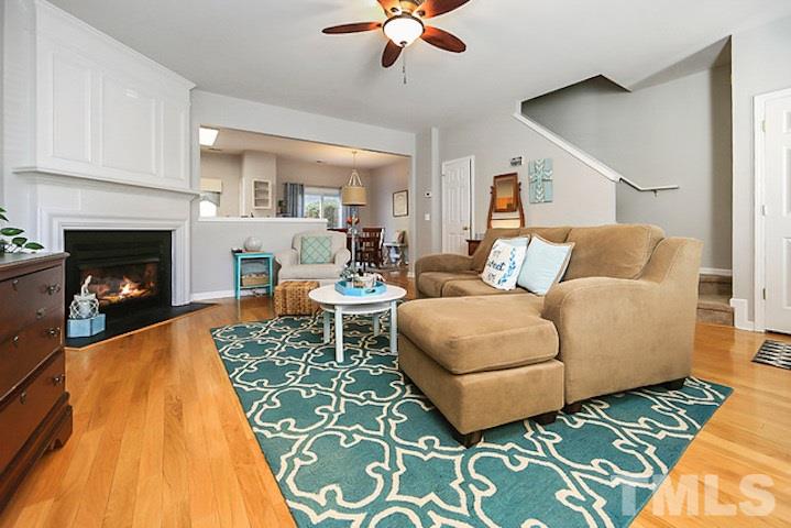 5013 Echo Ridge Road Raleigh, NC 27612 - Photo 3 of 15 a living room with furniture and a fireplace